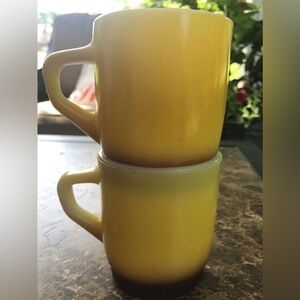 (2) Fire King Radiant Yellow Brown Stackable Mugs  D Handle
